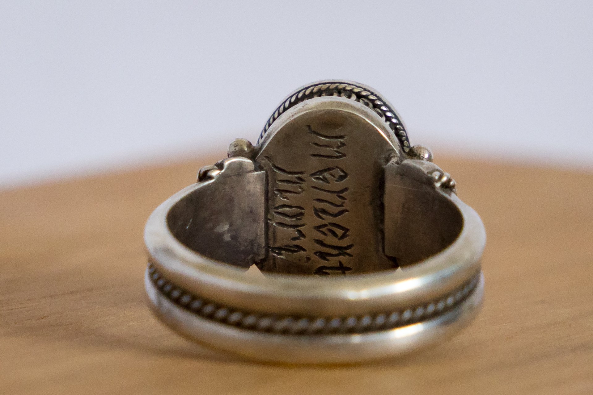 Detail of the engraved inscription inside the band of the Georgian silver memento mori ring.