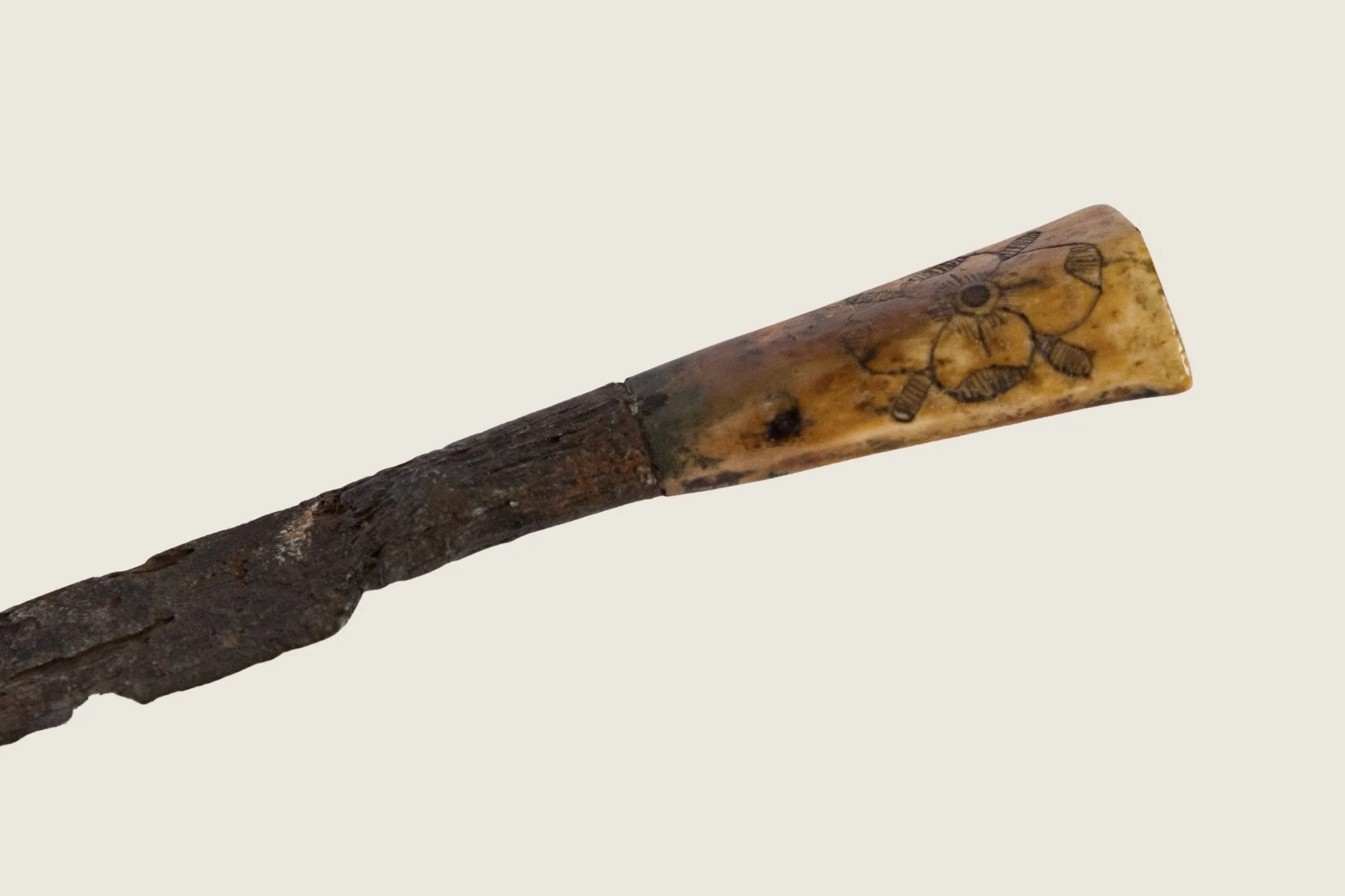 Close view of the decorated handle of the Stuart-period iron knife.