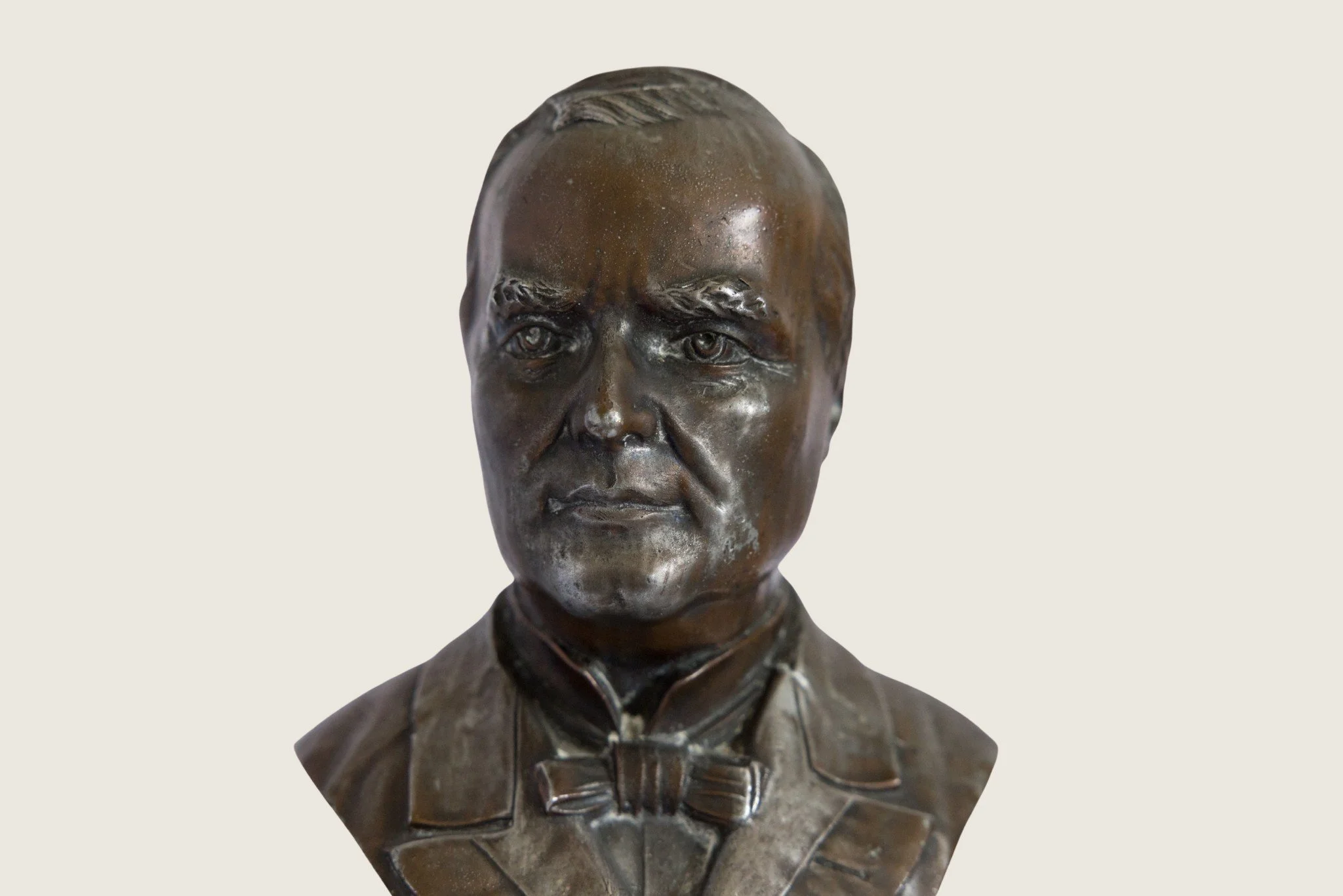 Close frontal detail of the modeled portrait on the William McKinley commemorative bust.