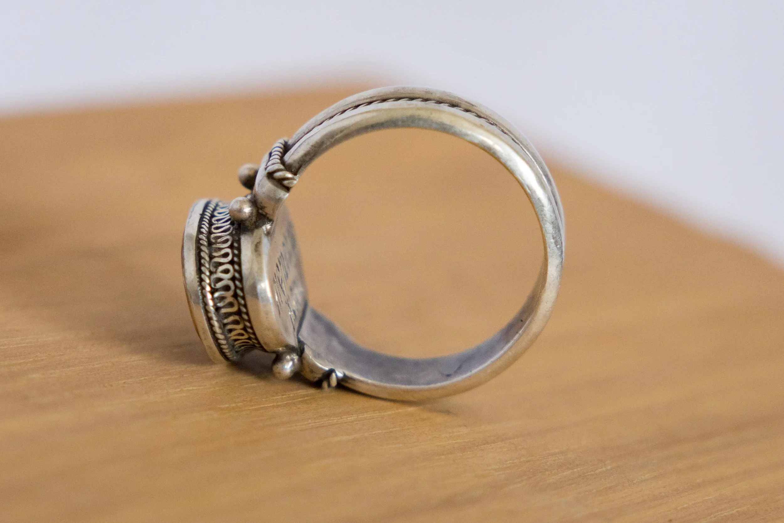 Side profile of the Georgian silver memento mori ring showing the raised bezel and band construction.