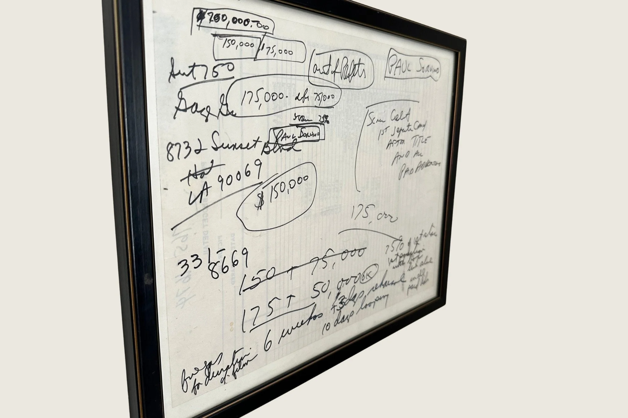 Angled view of the framed handwritten Cruising deal-point sheet.