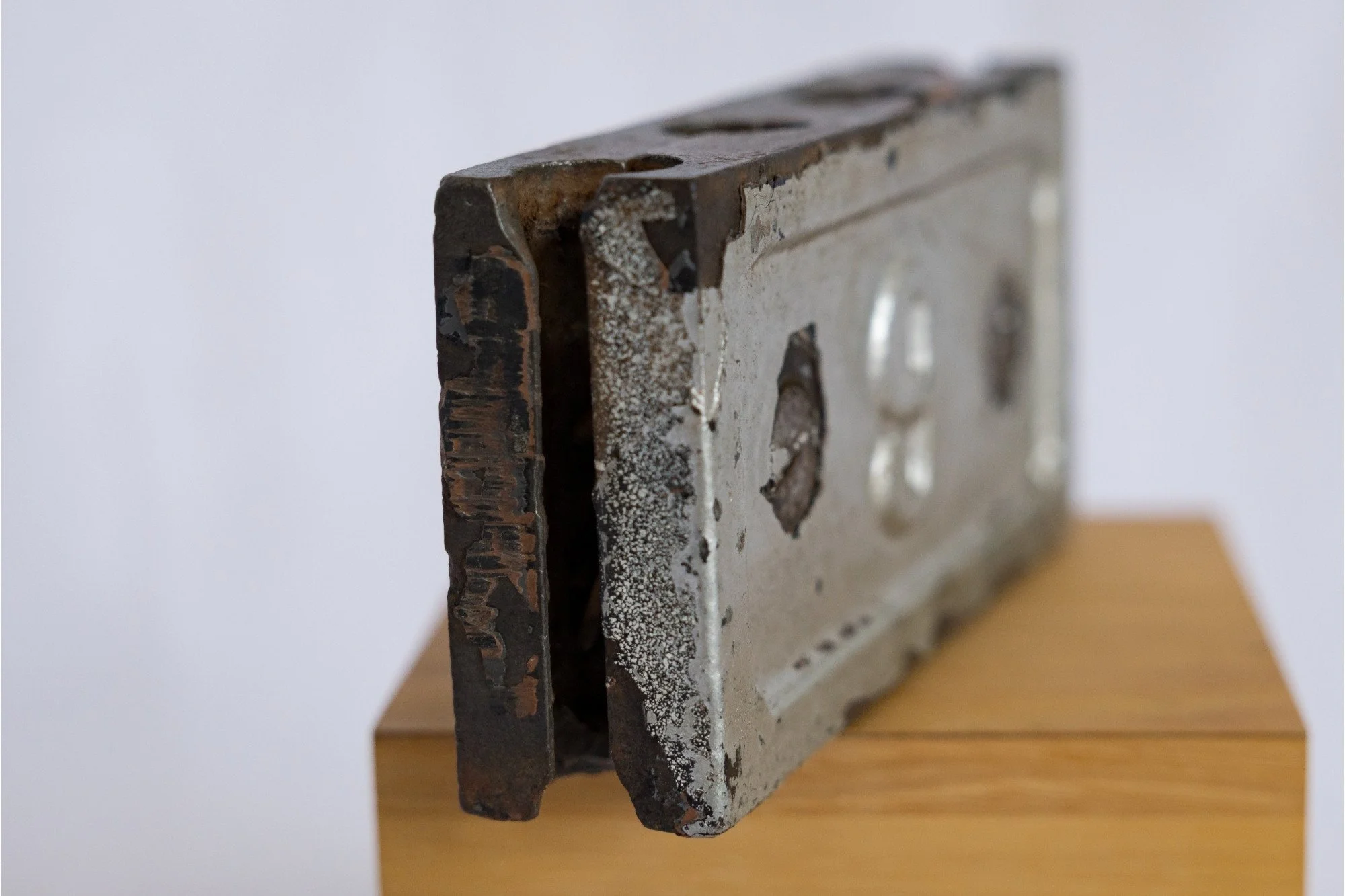 Angled full view of the No. 9 identification clamp, showing its depth and layered construction.
