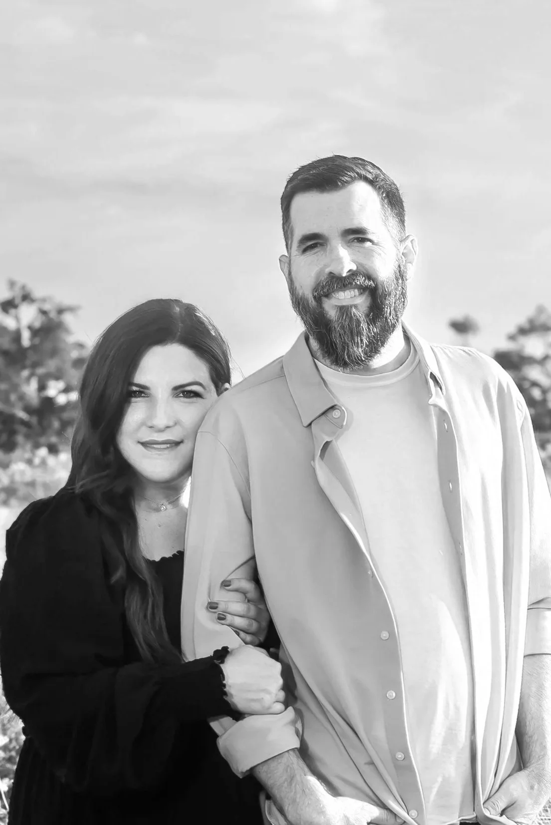 A black and white photo of Kevin and his wife Markie.
