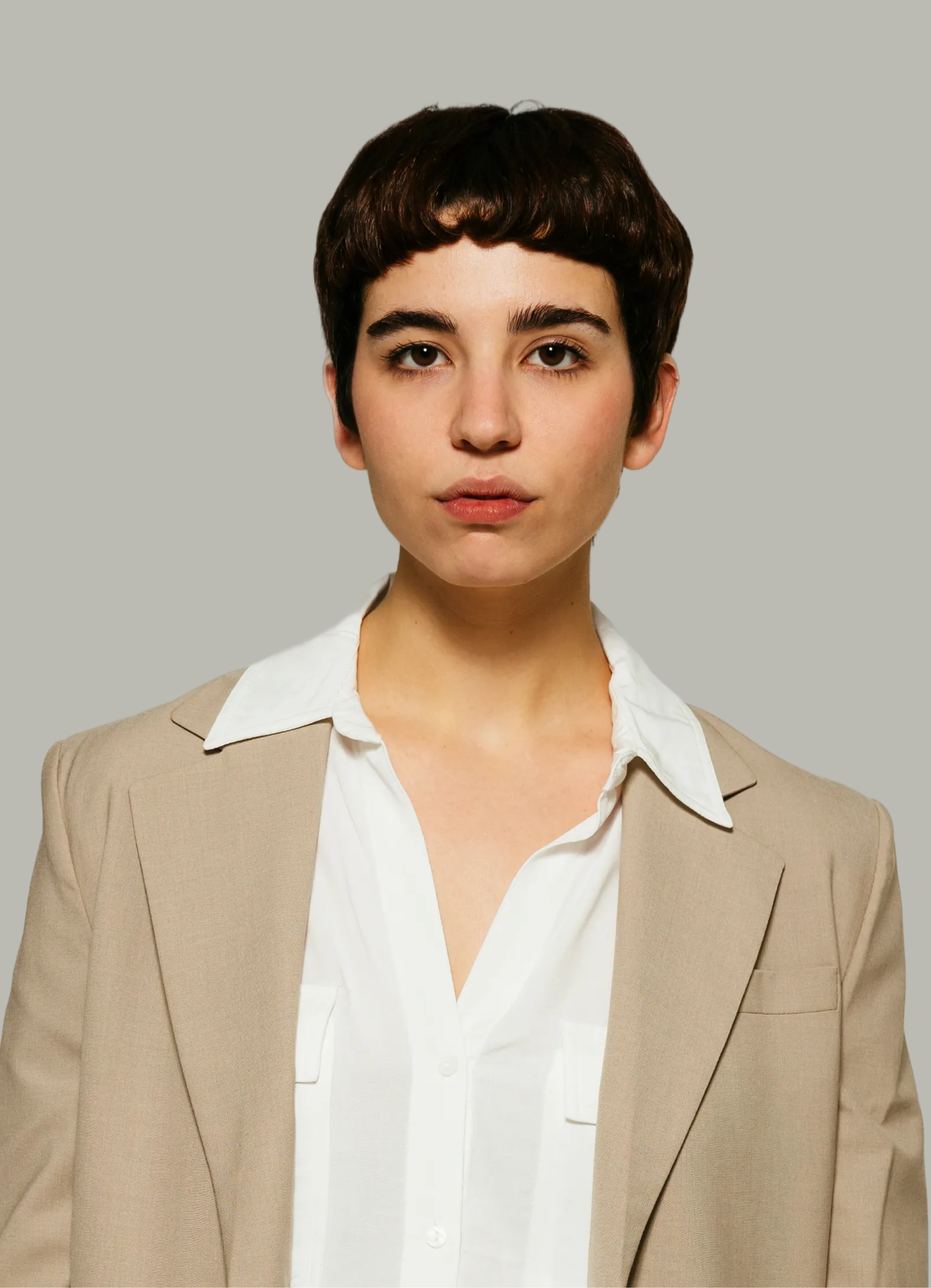 Portrait of a tutor in a tan blazer