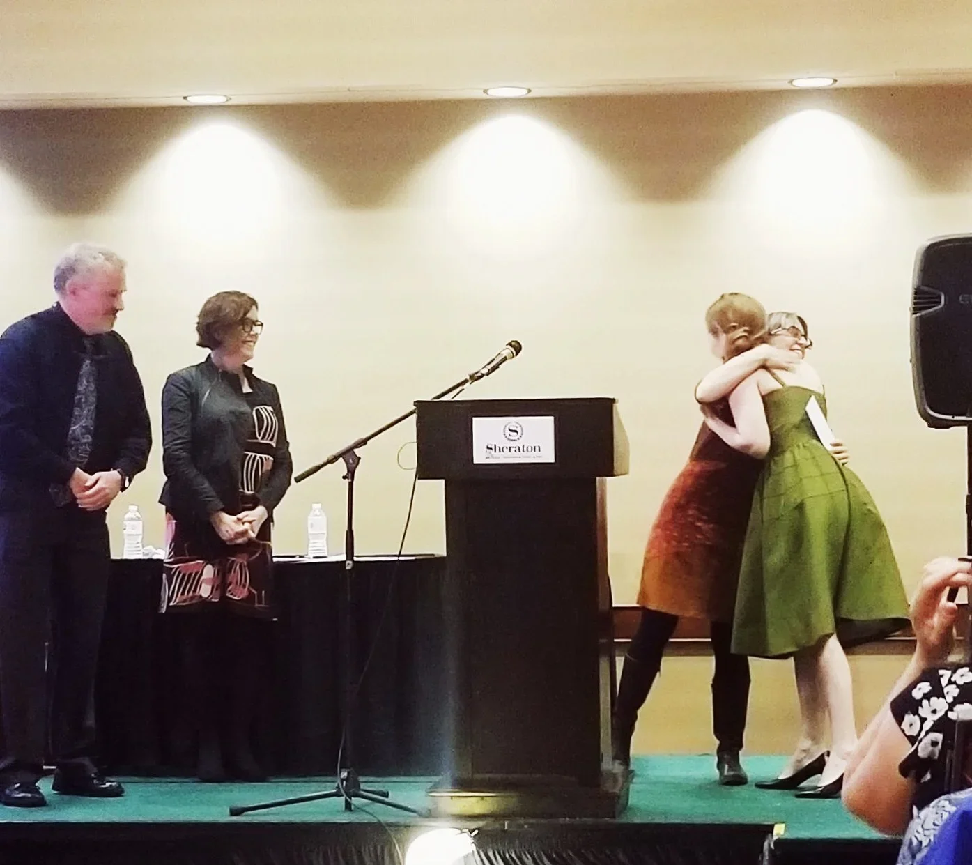  The ceremony—a room full of some of our Atlantic region’s most enduringly funny, poignant, and deeply talented novelists, poets, and book-creators. They call my name! 