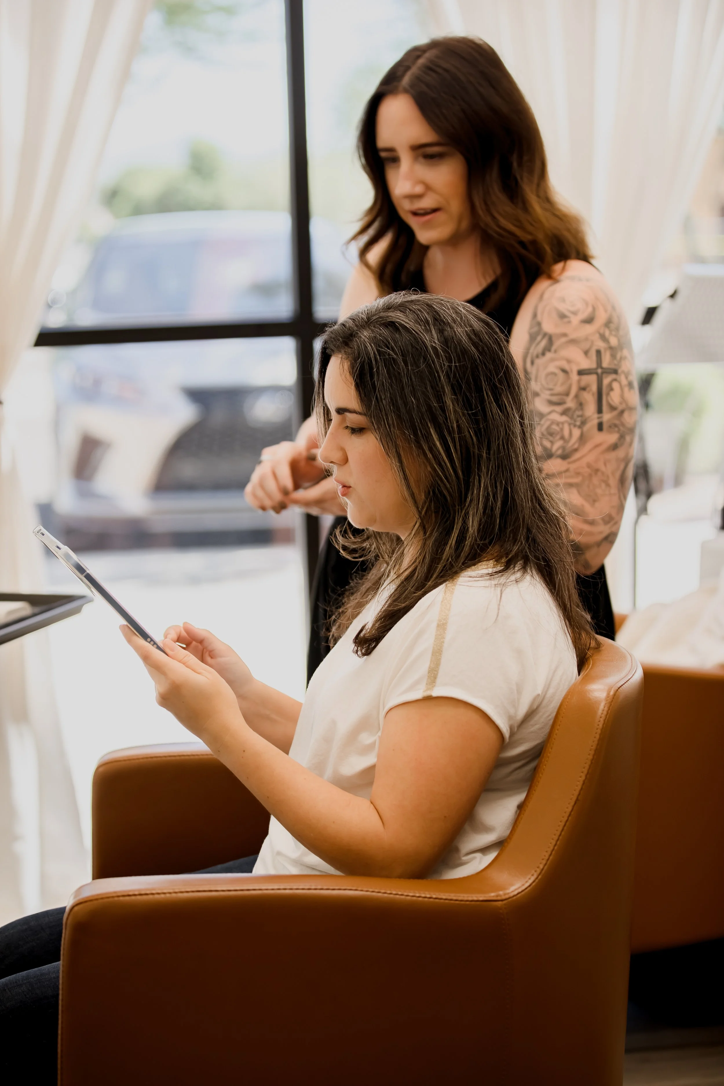 client looking at epigenetic hair strand analysis results based on hair strand test with hair loss specialist Sara Connors in scottsdale Arizona