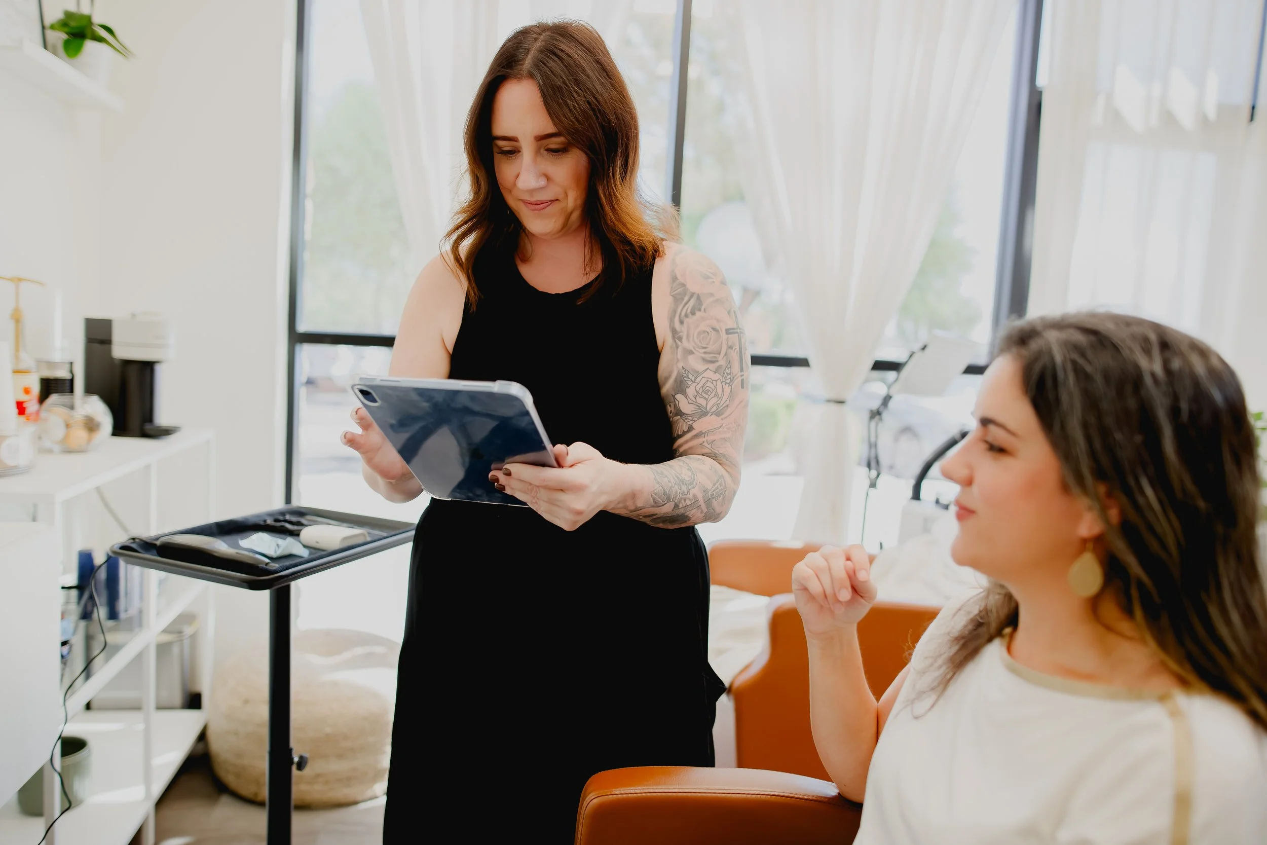 Hair loss specialist doing a Hair Health Assessment for hair loss concerns in North Phoenix at Connors Collective Hair Studio where they specialize in holistic hair loss support