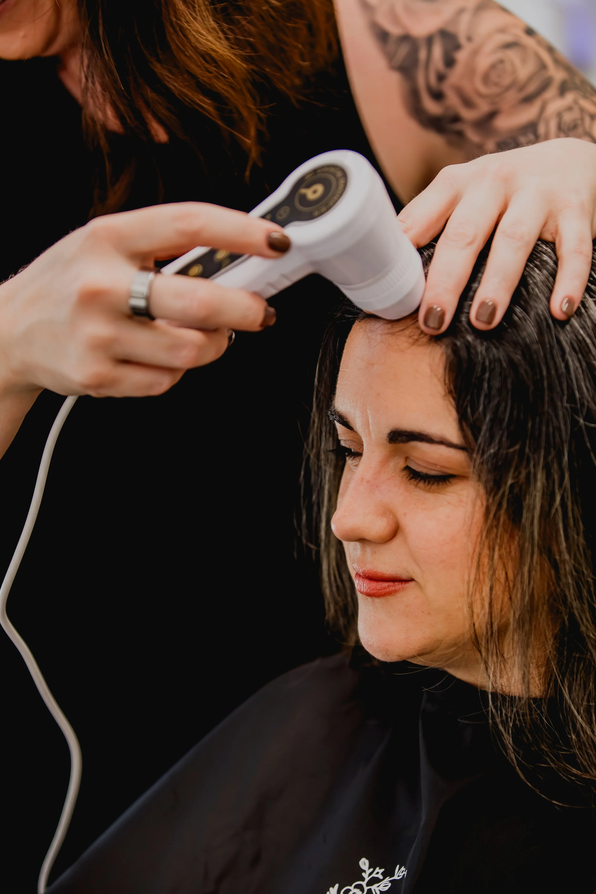 Dermascope being used by a hair loss specialist in Scottsdale Arizona on her guest.