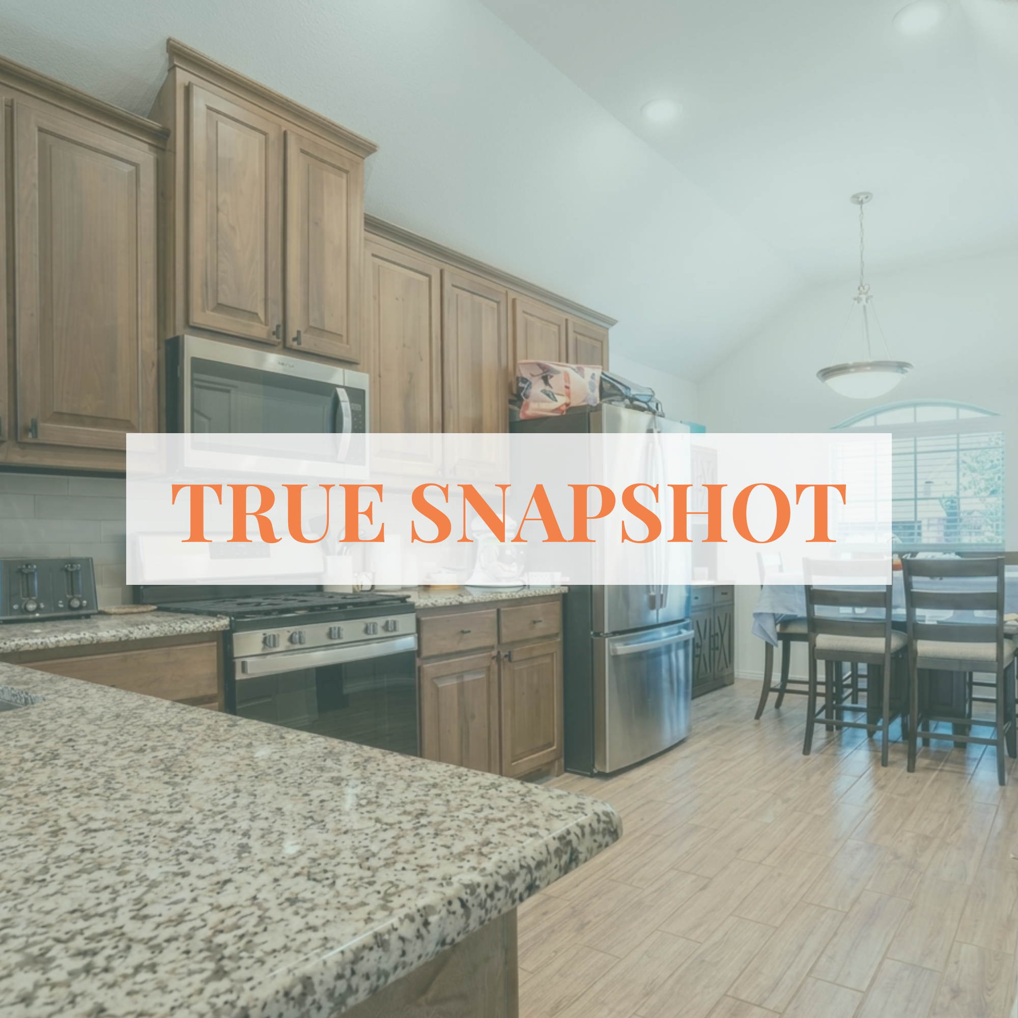 View of a kitchen with wooden cabinets, stainless steel appliances, a granite countertop, a dining table with chairs, and a high, vaulted ceiling with ceiling lights and a hanging light fixture.