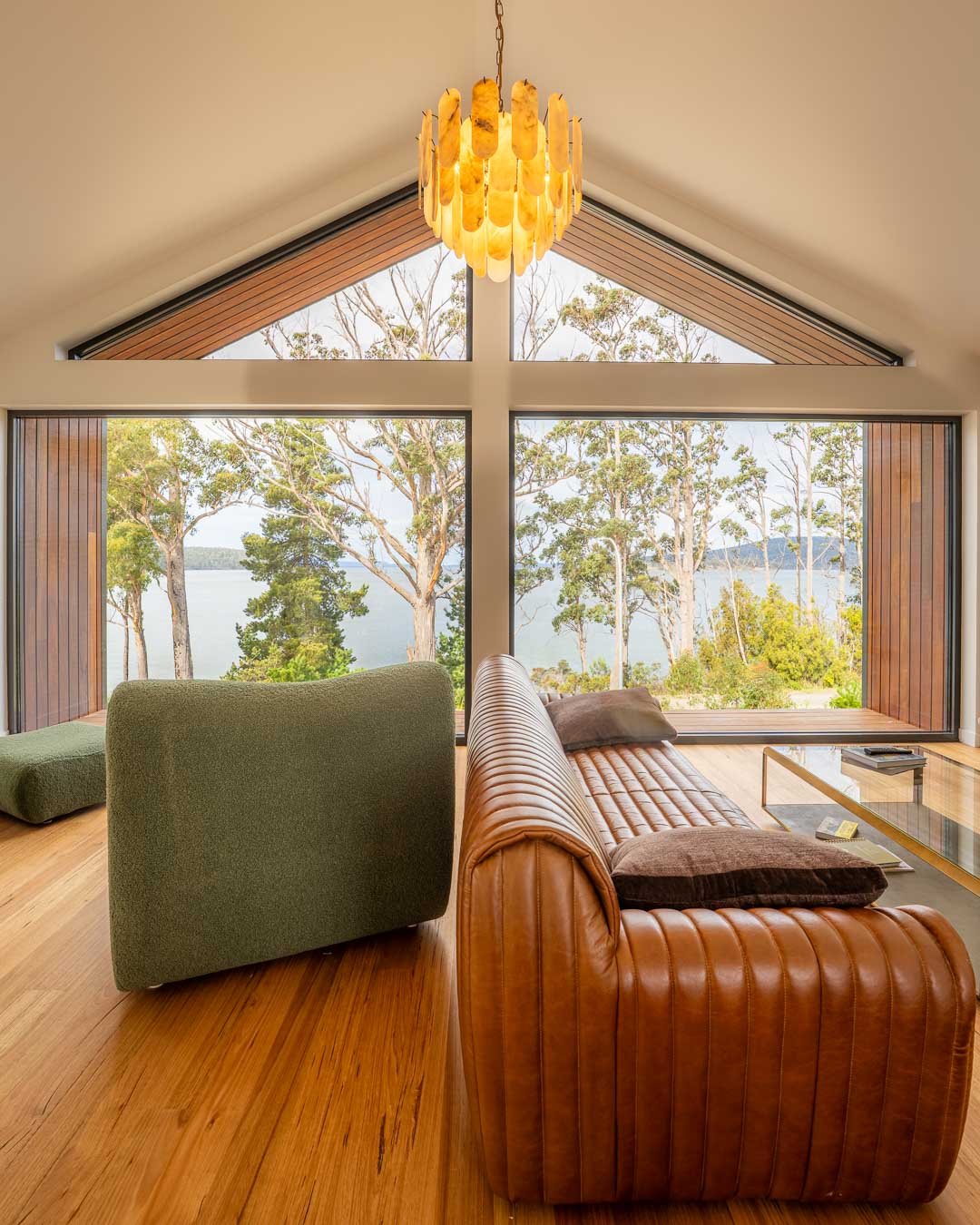 A lounge room with a beautiful chandelier