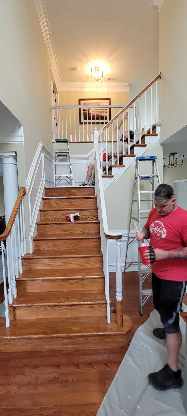 Professional painter painting interior staircase