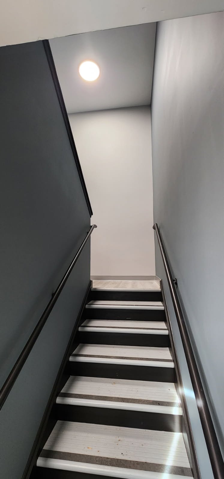 Professional painter in Chester Springs paints the interior of a commercial building