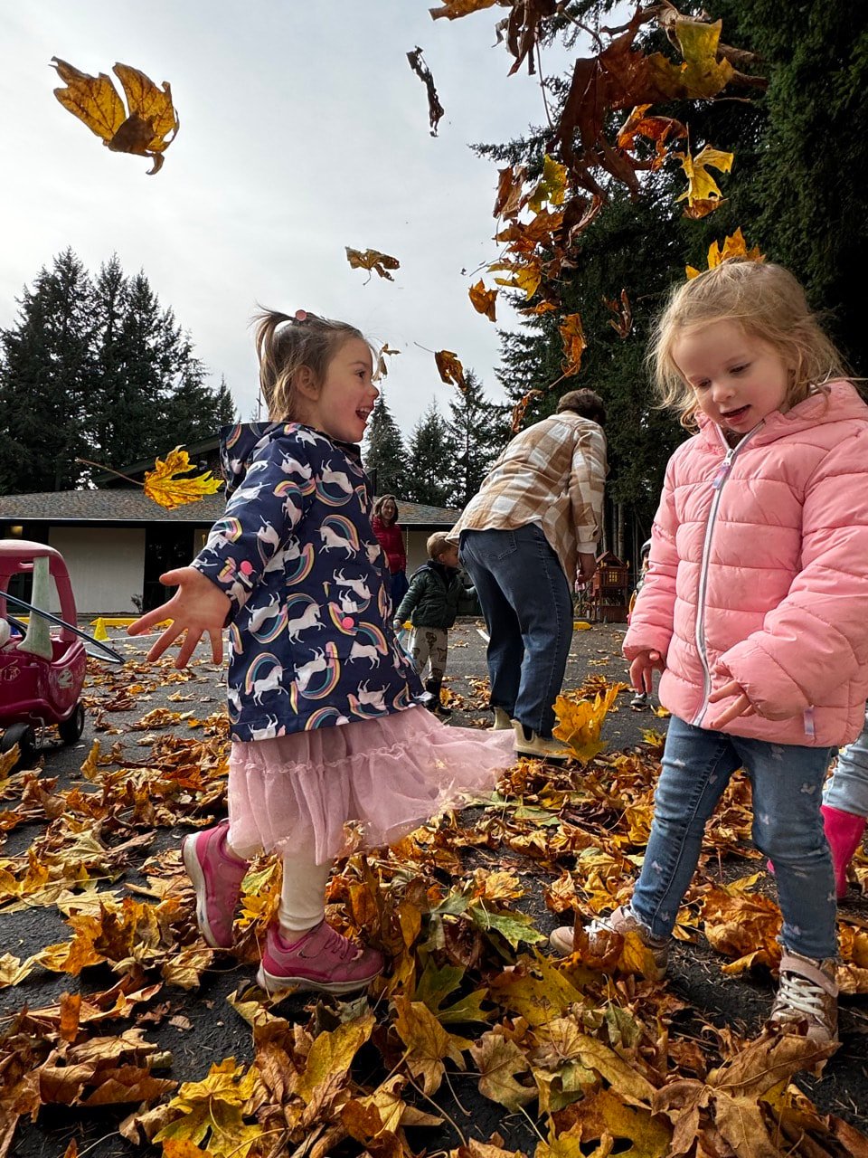 Children enjoying outdoor play while exploring the changing seasons.