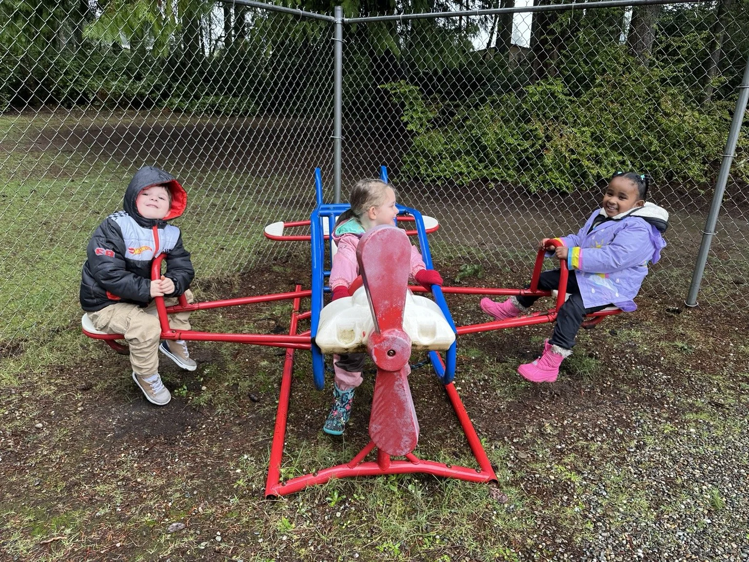 Children enjoying active outdoor play on the playground.