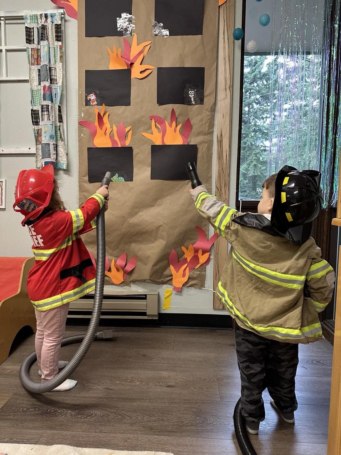 Children exploring community helpers through imaginative play.