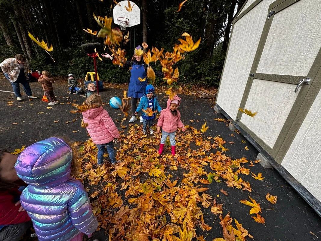 Children enjoying outdoor play while exploring the changing seasons.
