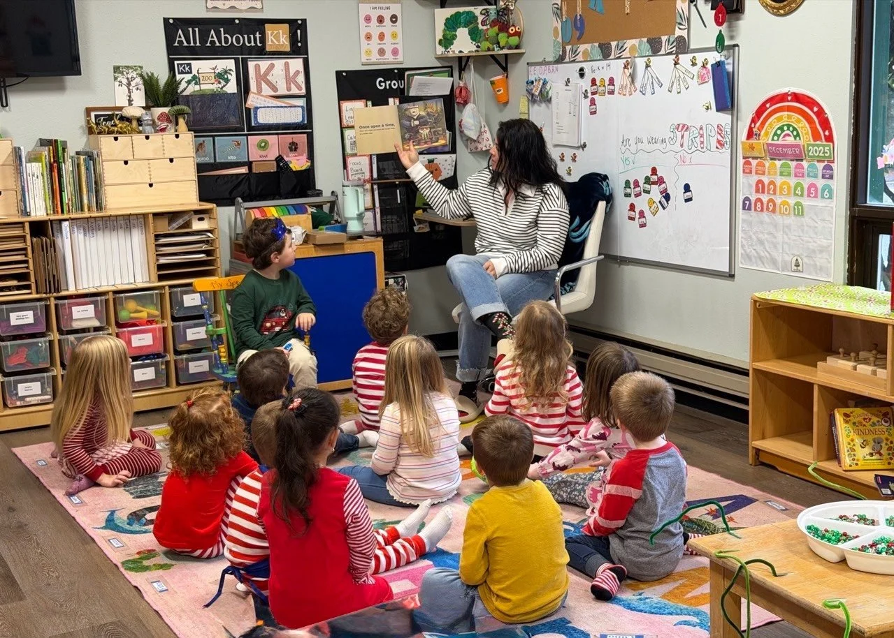 Teacher leading an engaging story time with preschool students during circle time.