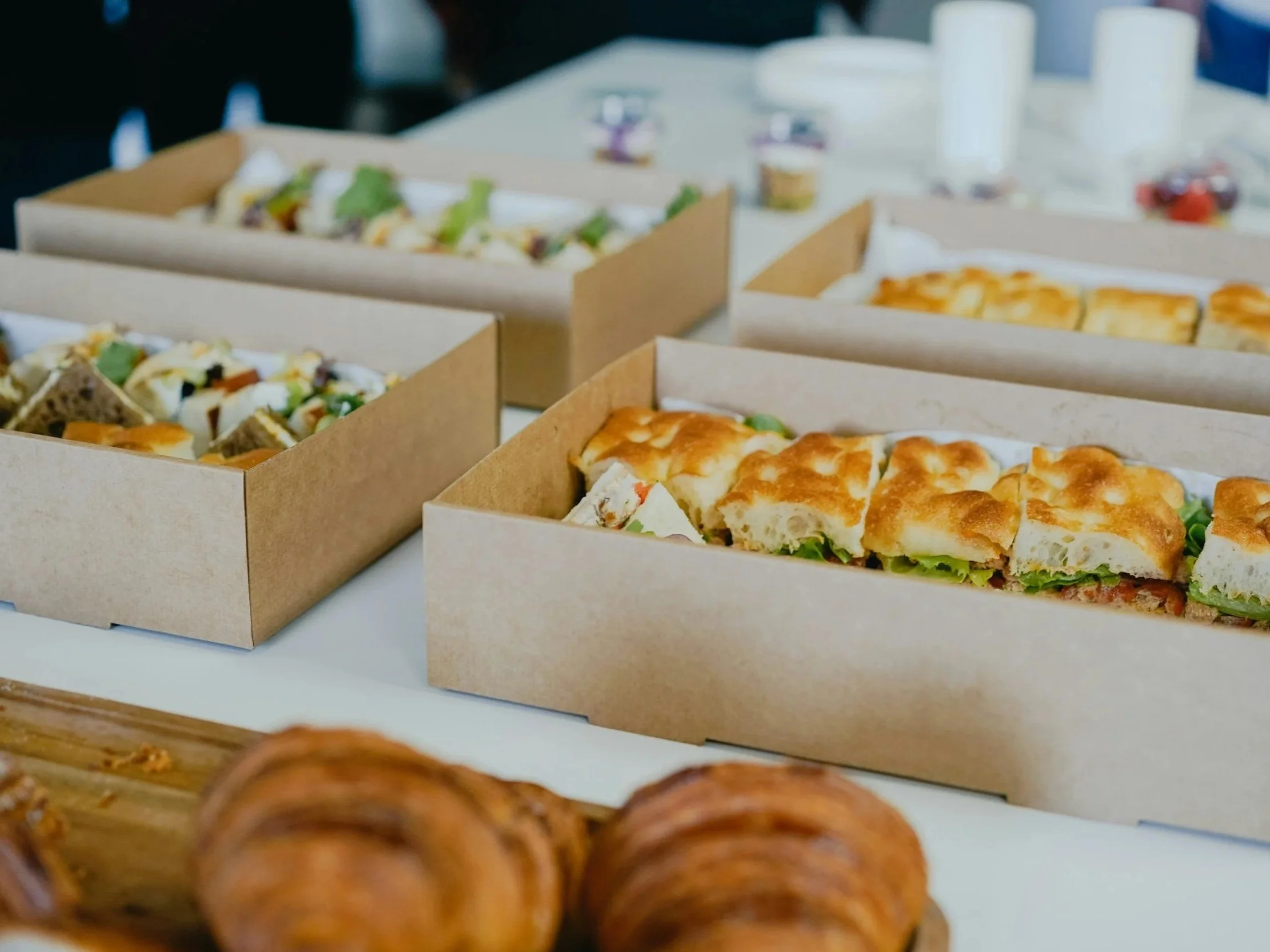 Corporate lunch buffet with hot and cold catering options.