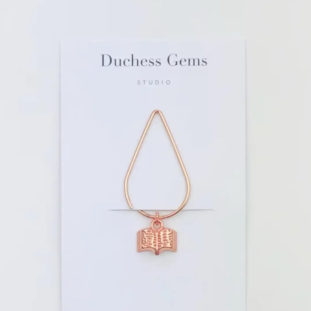 rose gold book charm.webp