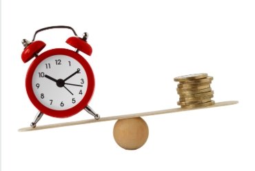 A red alarm clock balanced on a seesaw with a stack of coins on the other end.