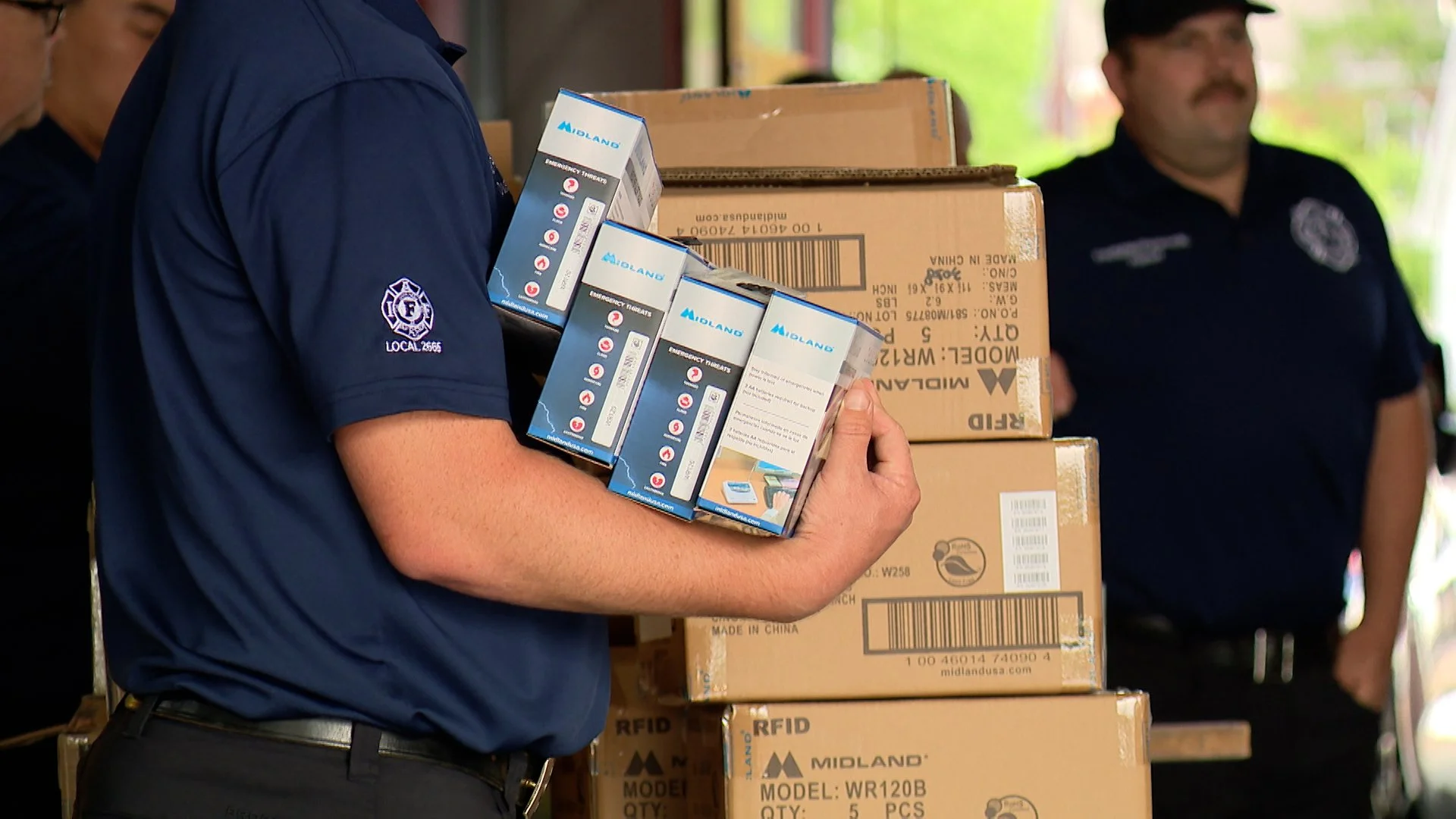 First responders handing out Midland NOAA Weather Alert Radios
