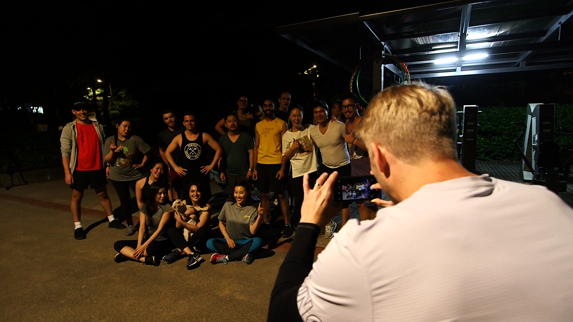 PowerSweat Korea ParkFit community — group photo after an outdoor evening training session in Seoul