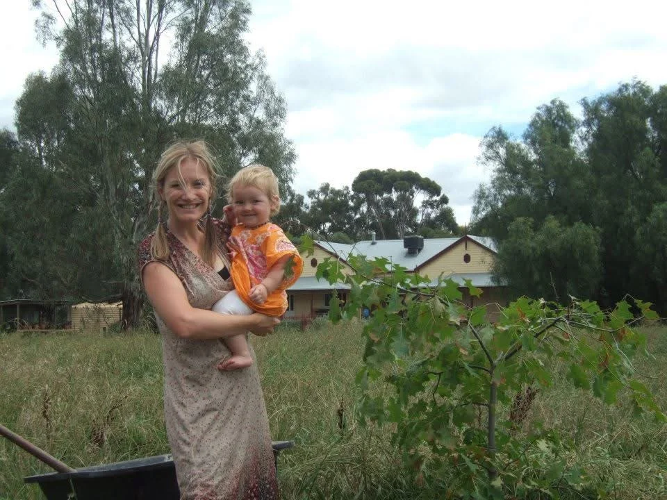 Terrina holding her baby outdoors