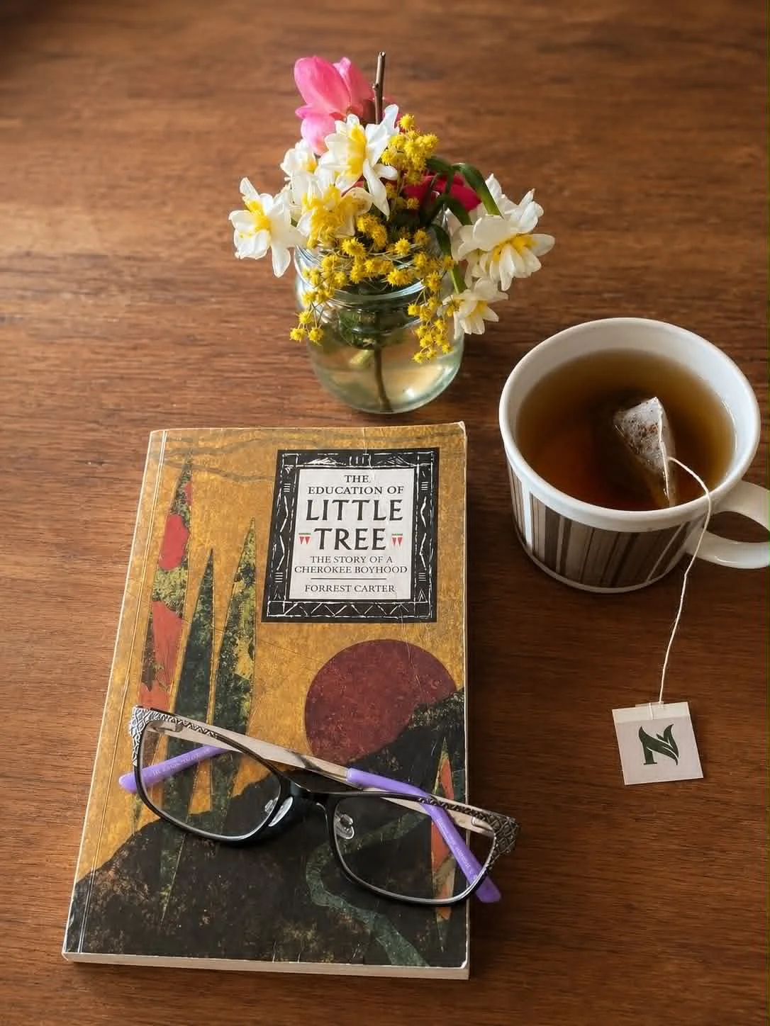 The Education of Little Tree book with a cup of tea