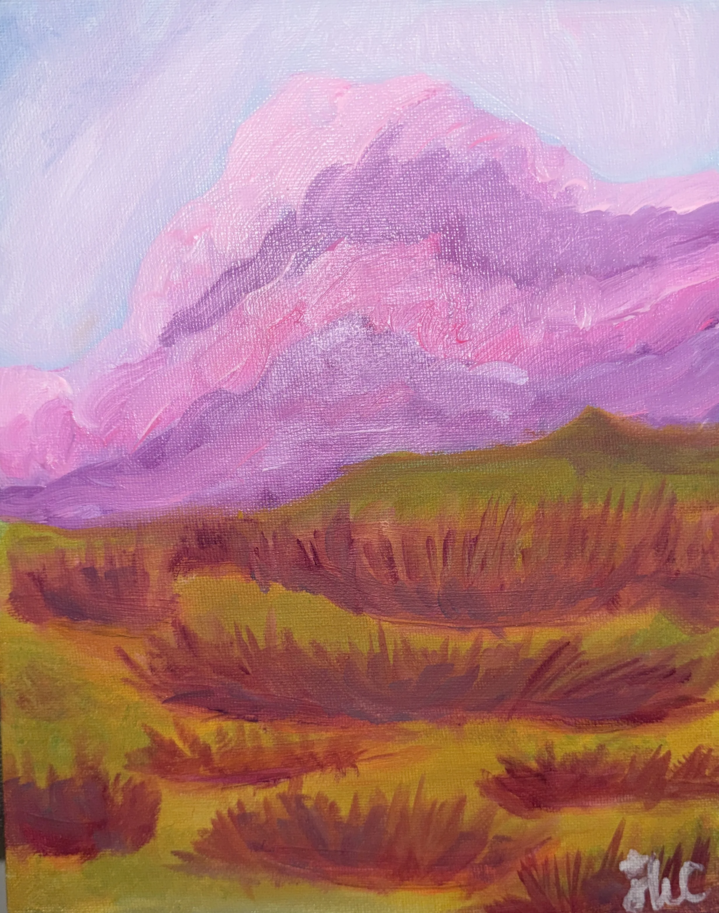 Abstract landscape painting with a pink and purple mountain and yellow, orange, and red sky.