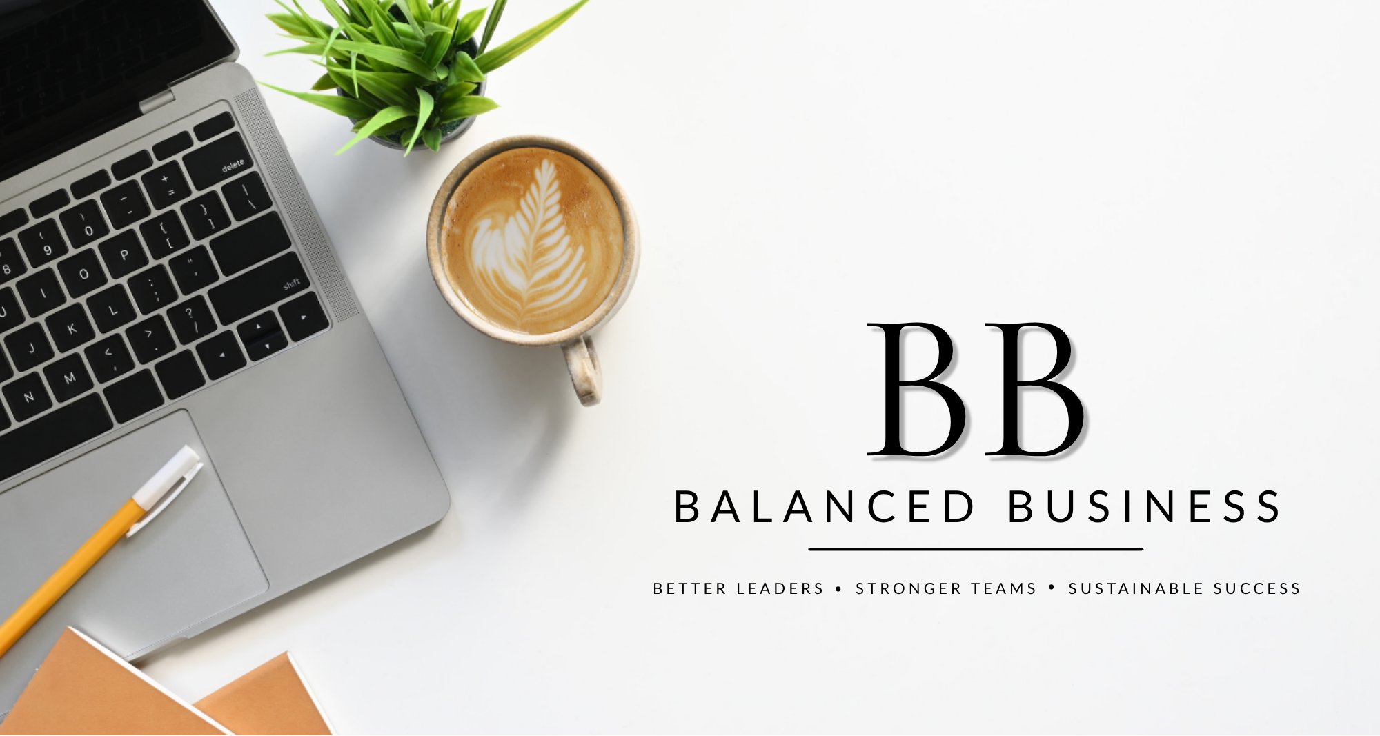 A laptop, a potted plant, a coffee cup with latte art, a yellow pen, and business materials on a white desk with text overlay reading "Balanced Business" and tags for leadership, teamwork, and sustainability.