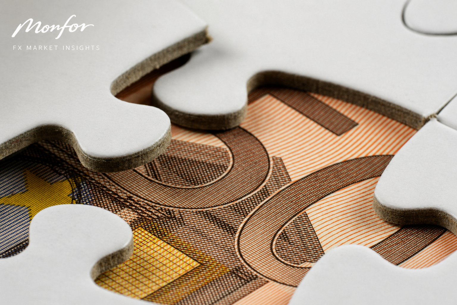 Monfor FX Market Insights featuring a close-up of a euro banknote beneath interlocking puzzle pieces, representing the euro, European markets, ECB policy and the complexities of global foreign exchange.