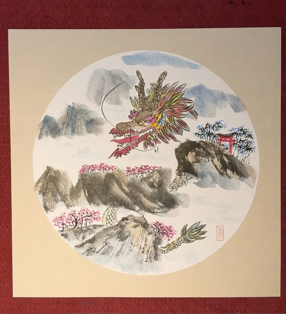 A traditional Asian watercolor painting of a dragon in a mountainous landscape with pink cherry blossoms and bamboo, presented within a circular frame.