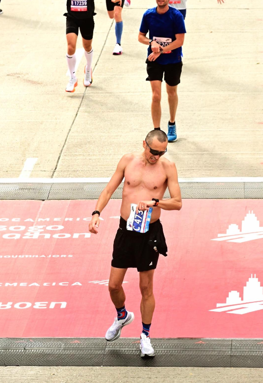Ciprian Ungureanu Crossing the finish line at the Chicago Marathon