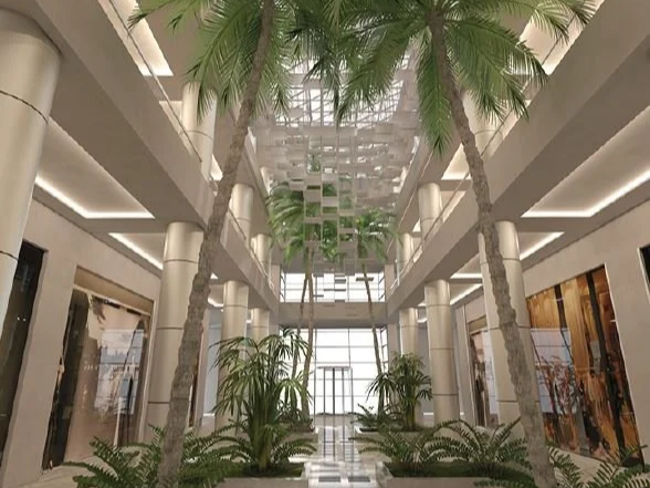 Contemporary hospitality interior featuring expansive atrium spaces, natural daylight, landscape integration, and an inviting customer experience.