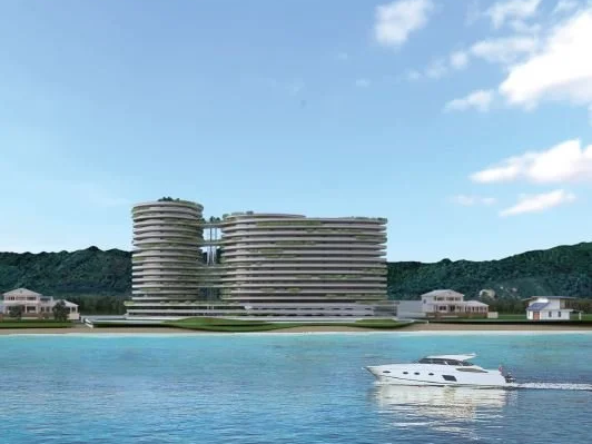 Luxury waterfront hospitality architecture showcasing dynamic building forms, contemporary design, and integrated public spaces.