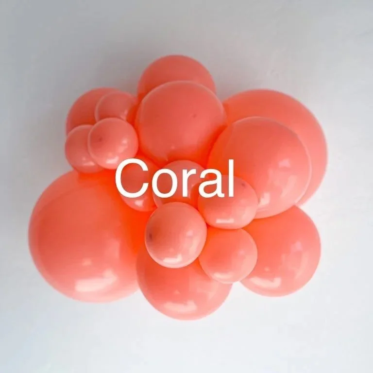 A cluster of coral-colored spheres of varying sizes with the word "Coral" overlayed in the center.