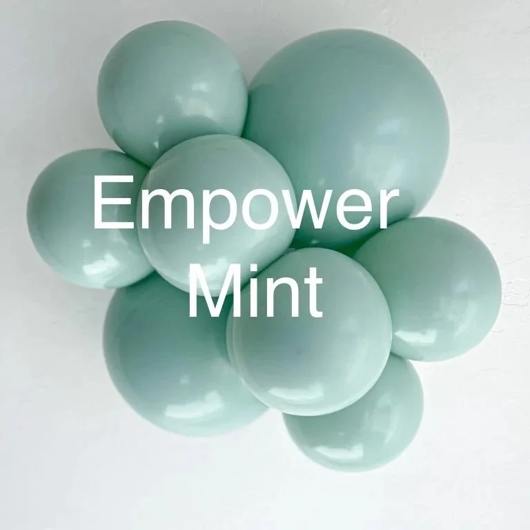 A cluster of light green spheres with the words 'Empower Mint' written in white in the center.