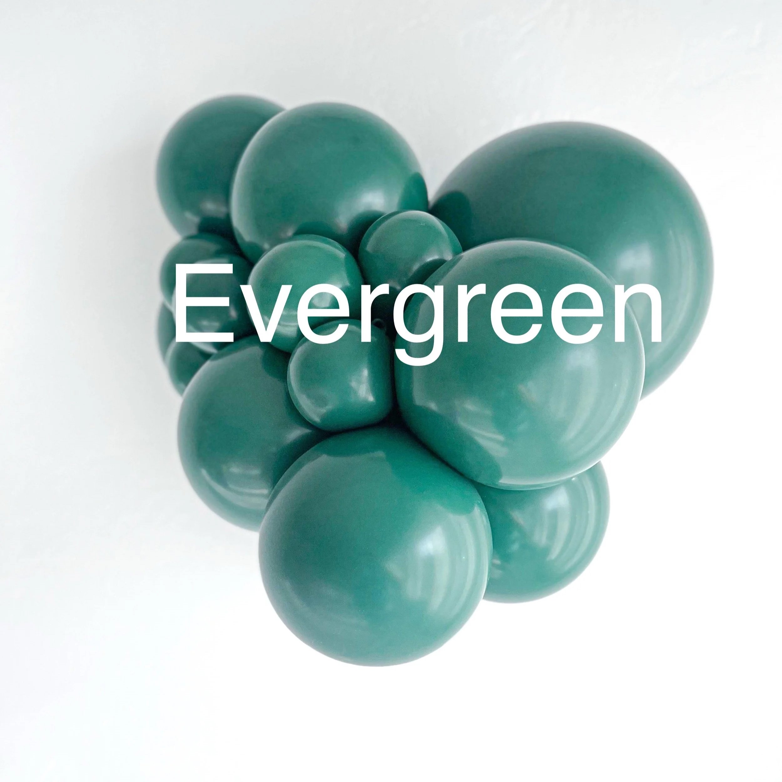 A collection of spherical objects in various sizes colored in shades of green, arranged in an overlapping manner. The background is plain white and part of the word 'Evergreen' is visible at the bottom.
