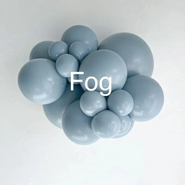 A cluster of light gray balloons of various sizes attached to a ceiling, with the word 'Fog' written over them.