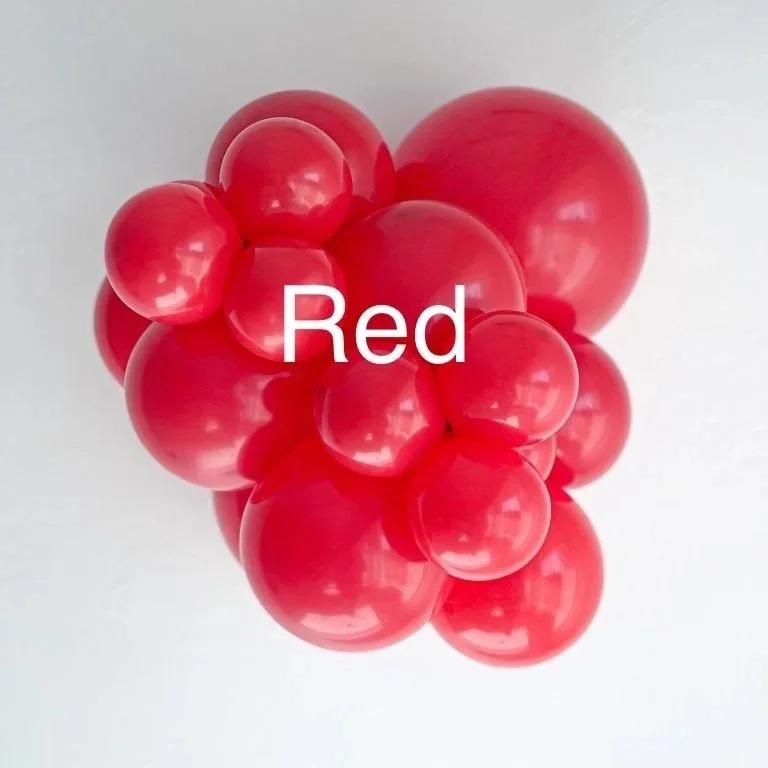 A cluster of red balloons with the word 'Red' written on them.