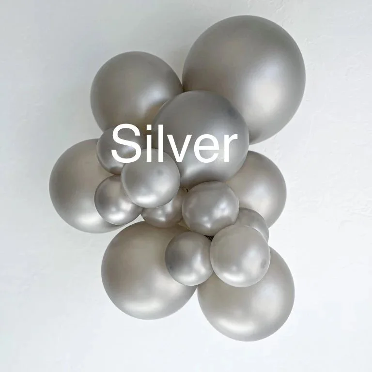 Cluster of silver balloons with the word "Silver" written across the middle.