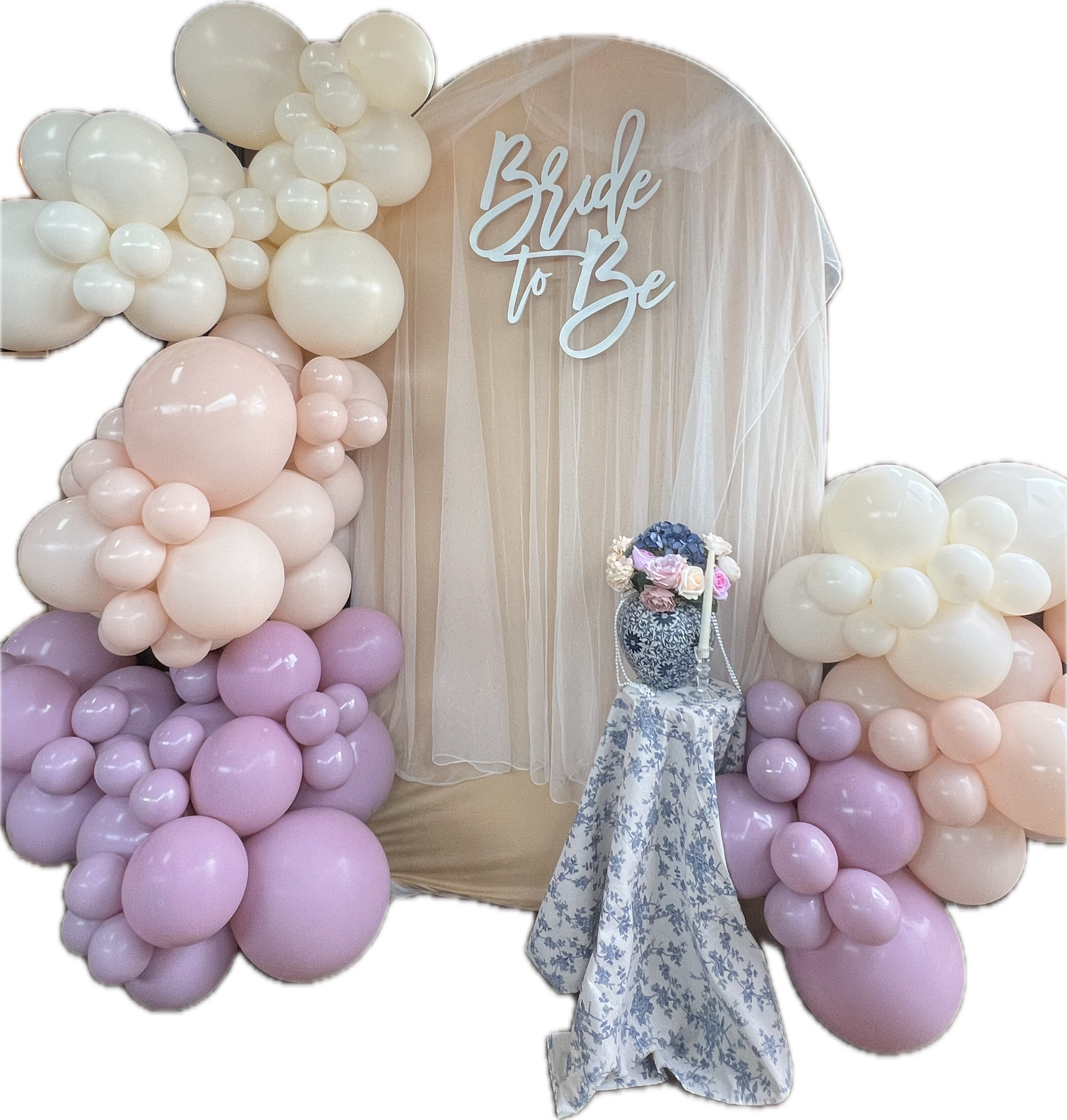 Decorative balloon arrangement with a sign reading "Bride to Be" and floral bouquet