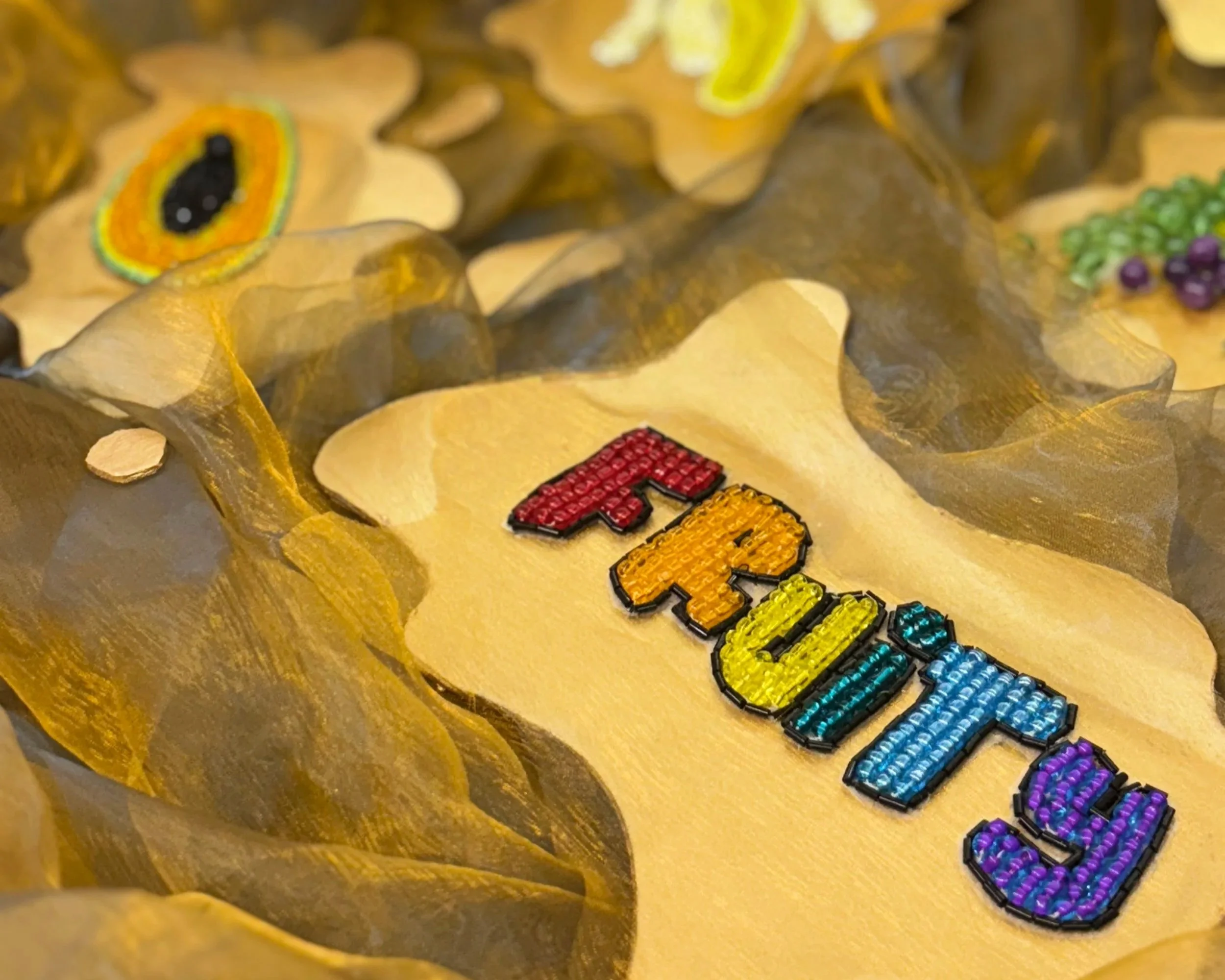 Alexis Fredericks, FRUITY., hand-embroidered and beaded textile sculpture in the form of a cornucopia, exploring queer identity, visibility, abundance, and celebration through contemporary fiber art