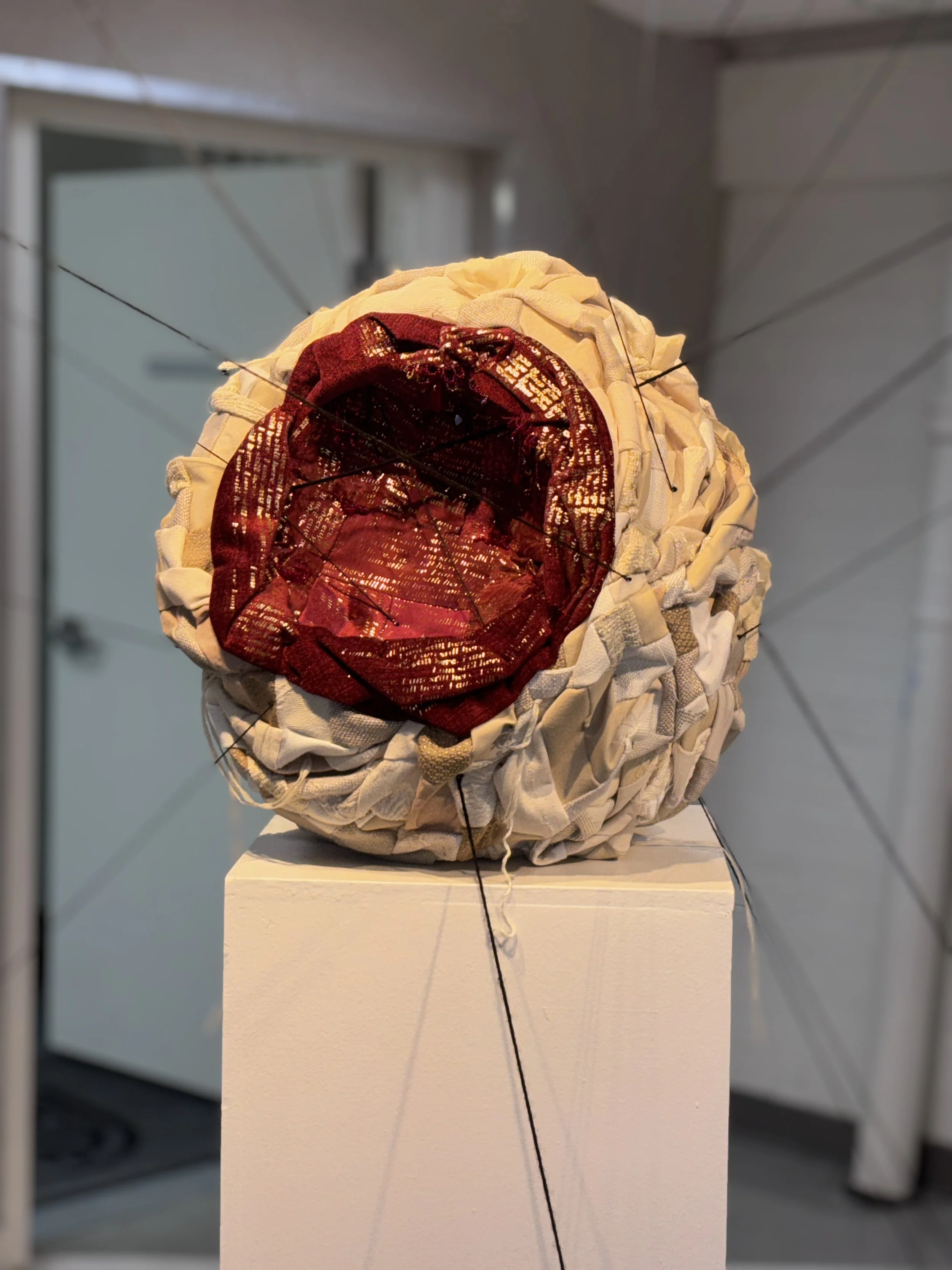 Alexis Fredericks, I AM STILL HERE., participatory textile installation fostering an encounter between viewer and artwork, where meaning emerges through active engagement rather than passive observation.