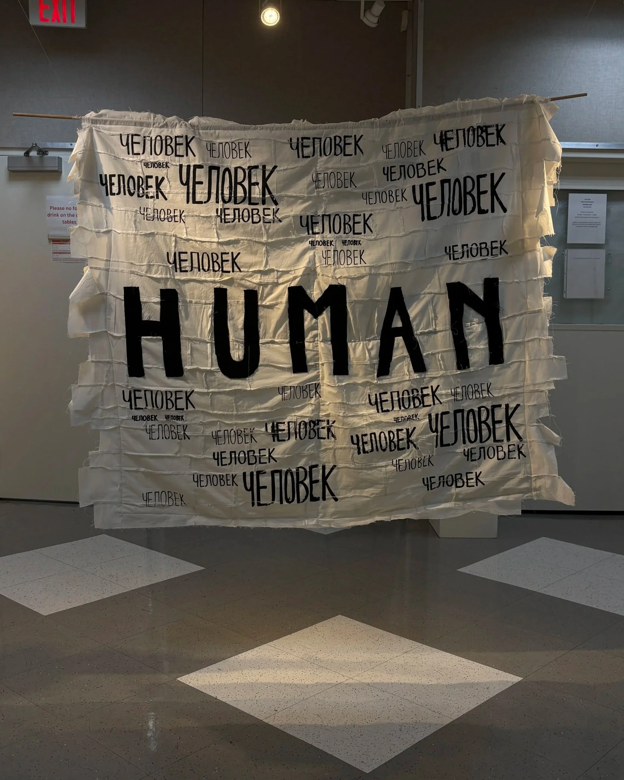 Alexis Fredericks, HUMAN., double-sided quilt installation examining memory, identity, and inherited histories through screen printing and appliqué.