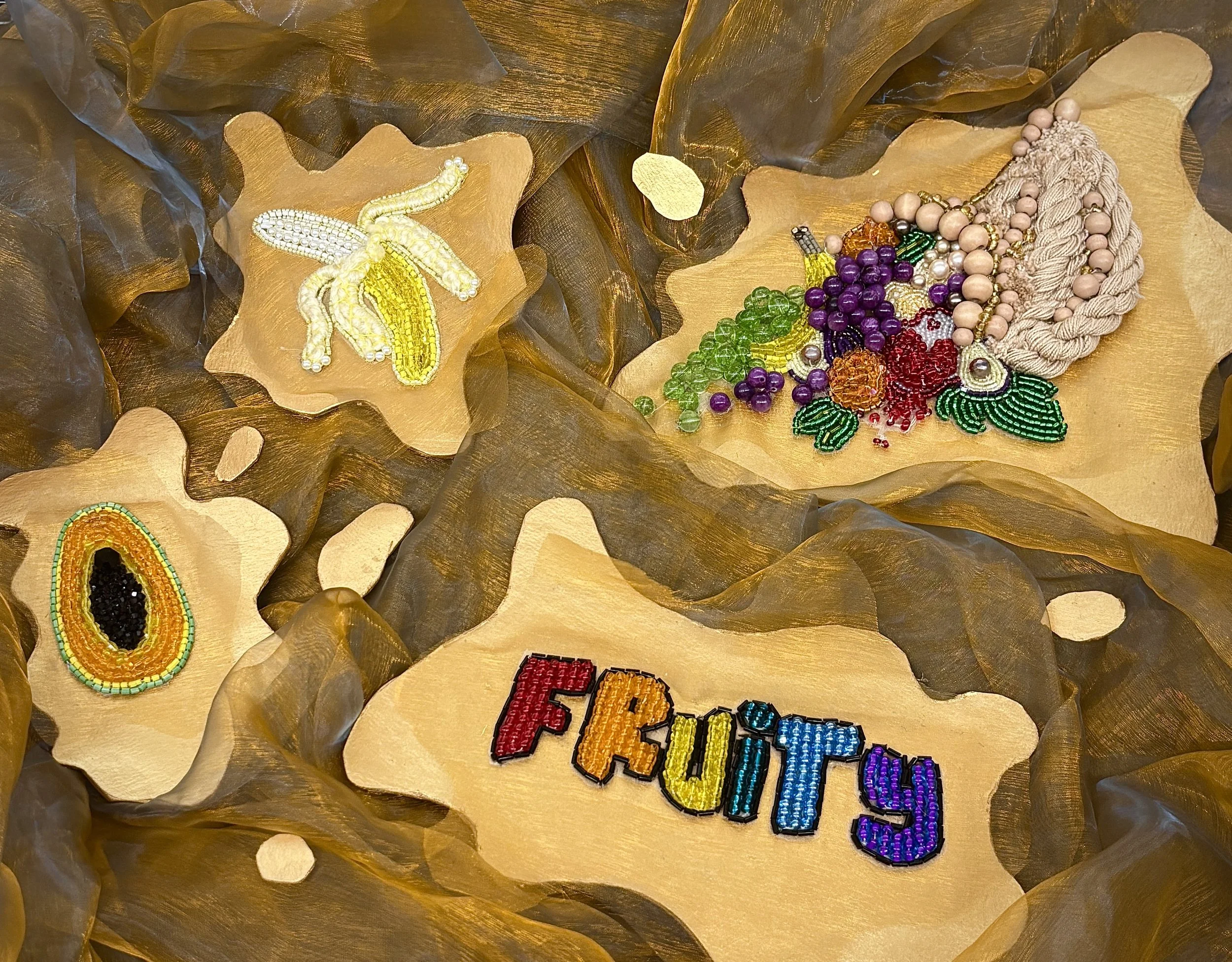 Alexis Fredericks, FRUITY., tambour embroidered and beaded cornucopia sculpture examining queer identity and abundance through contemporary textile practice.