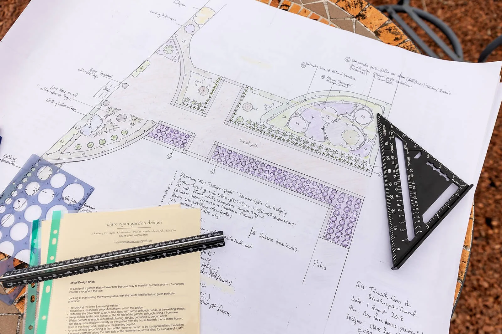 ruler and plan drawn out by clare for a garden with a path through planting