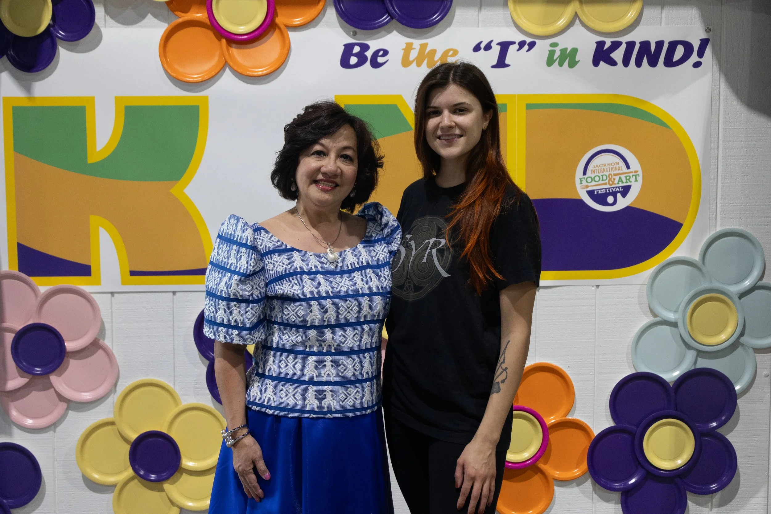 dee and lady in front of banner (H).jpg