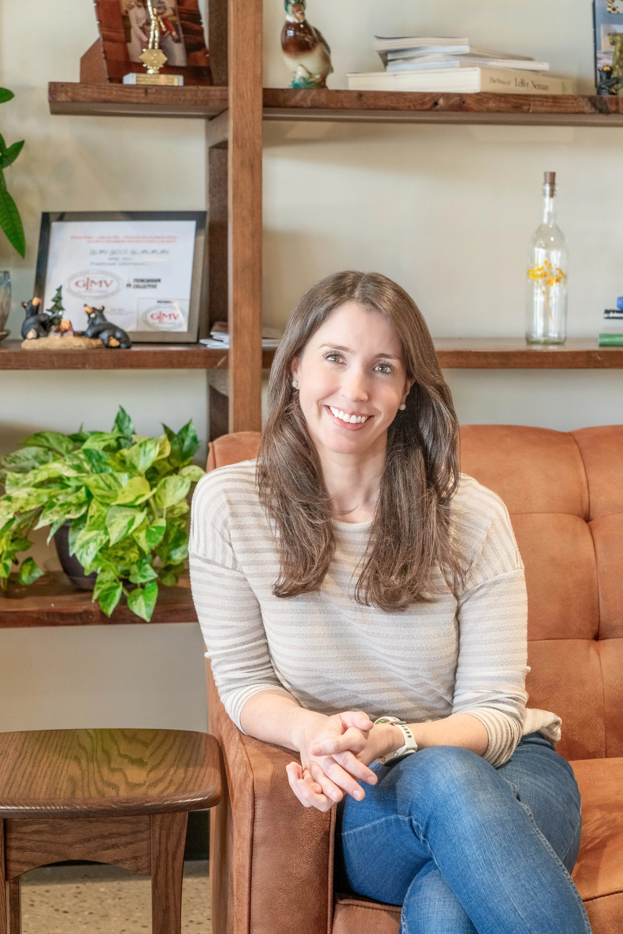 Rooted Fertility Co. co-founder, Laura Weppler, seated and smiling.