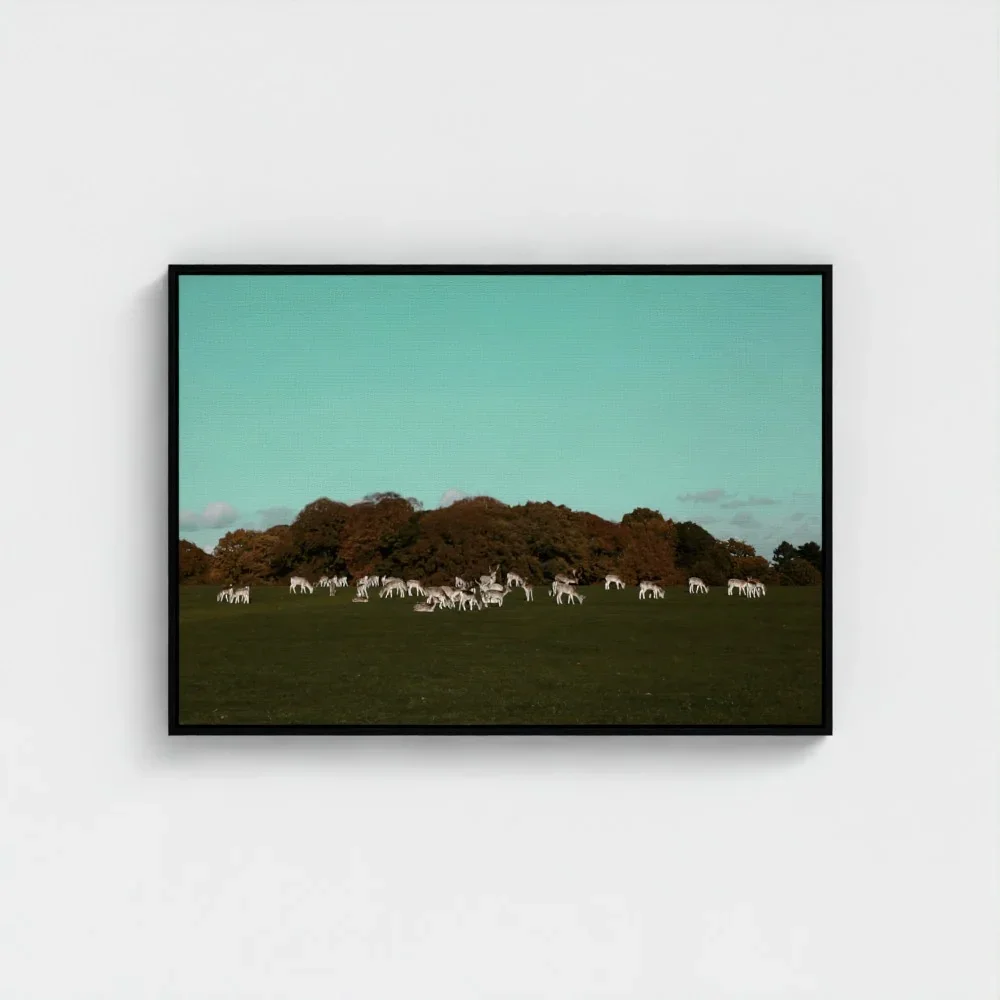 a-herd-of-deer-on-the-grassland- black-frame-canvas-28x40.webp